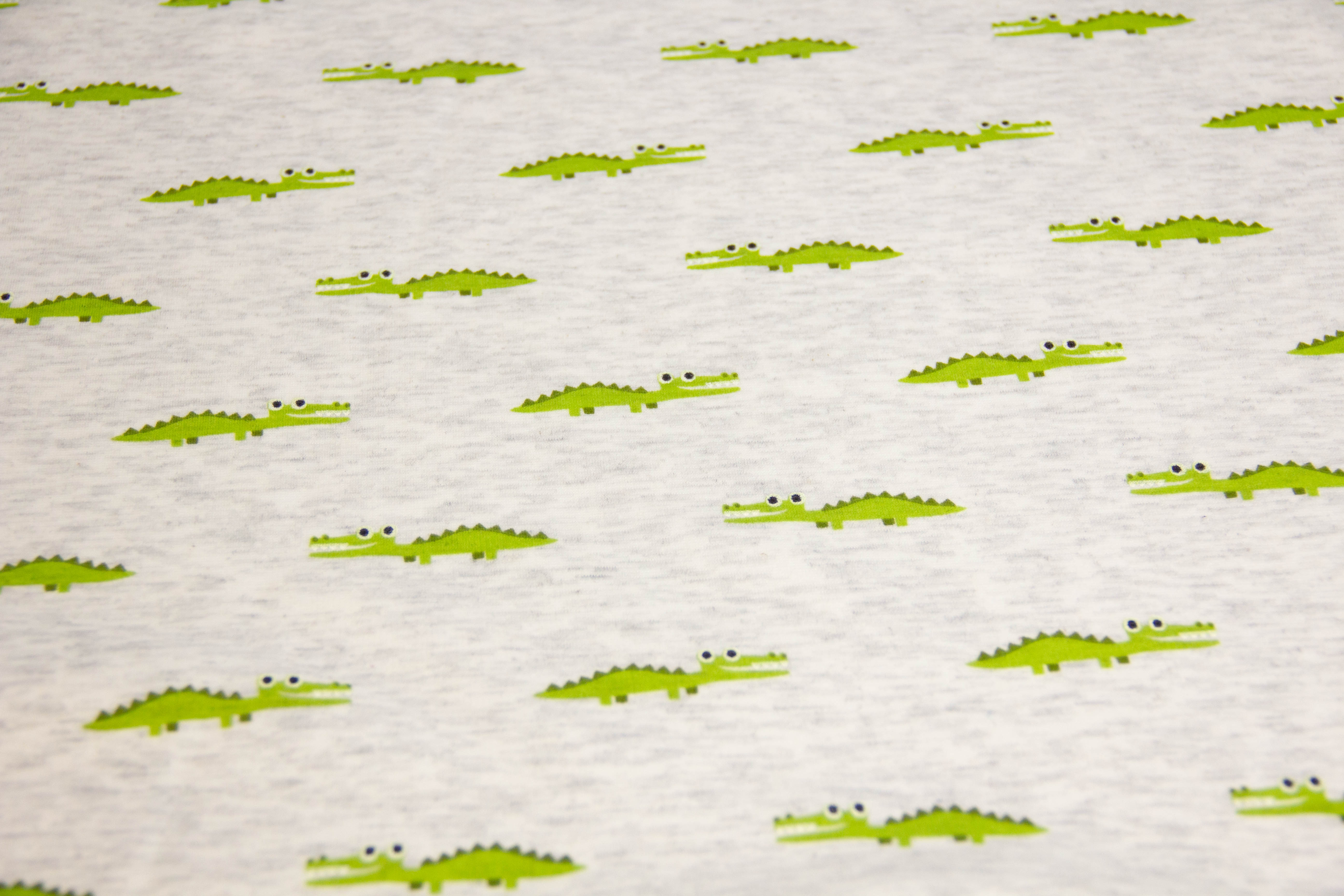 Alpenfleece mit Krokodilen, natur meliert, 0,5 m
