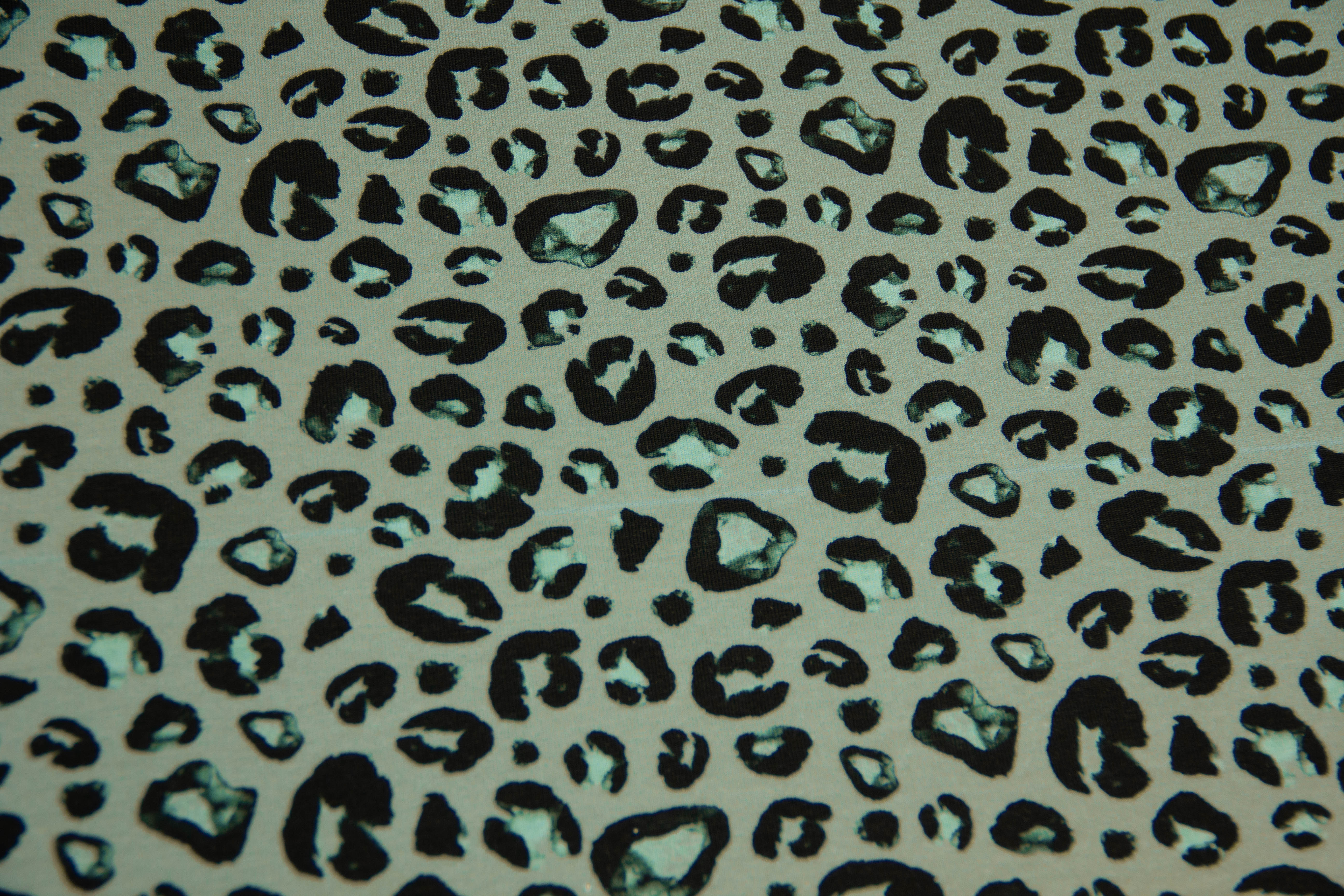 B-Ware 50 cm French Terry Leoprint, smaragd, schwarz