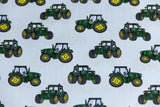 Baumwollwebware mit grünen Traktoren, hellblau, 0,5 m