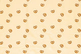 Jersey mit Brezen beige Meterware Kinderstoff