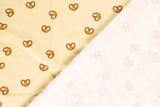 Jersey mit Brezen beige Meterware online kaufen T-Shirt
